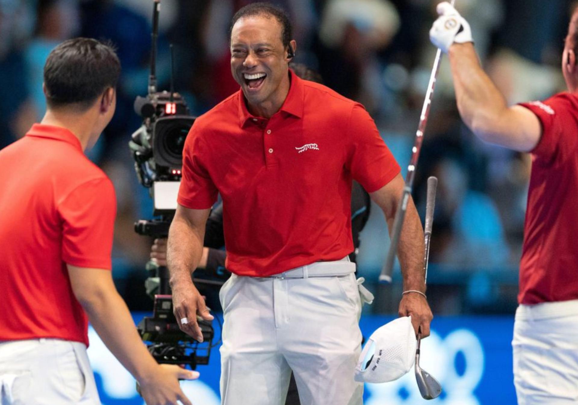 Tiger Woods celebrates after victory against McIlroys team at TGL